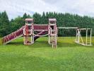 Vinyl Playset with 2 slides, a bridge, monkey bars 2 swings, and a trapeze swing